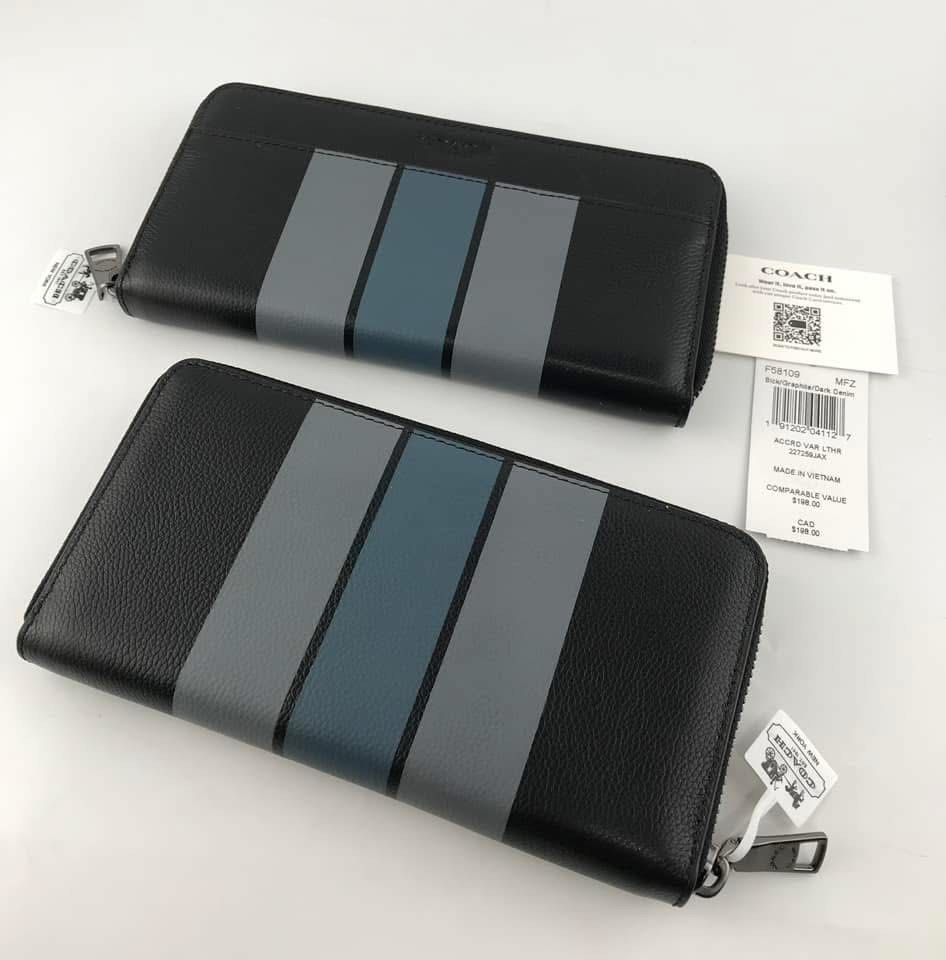 Coach Accord Zip Wallet Black Stripe (Category: Wallets & Card Holders) located in Caloocan City. Submitted by brandeditemsph (Listing ID 1451526849, Image 2). Description: - Coach Accord Zip Wallet - Color: Black with grey and blue stripe detail - Interior: Plenty of card slots and compartments - Closure: Zipper - Condition: Brand new with tags.