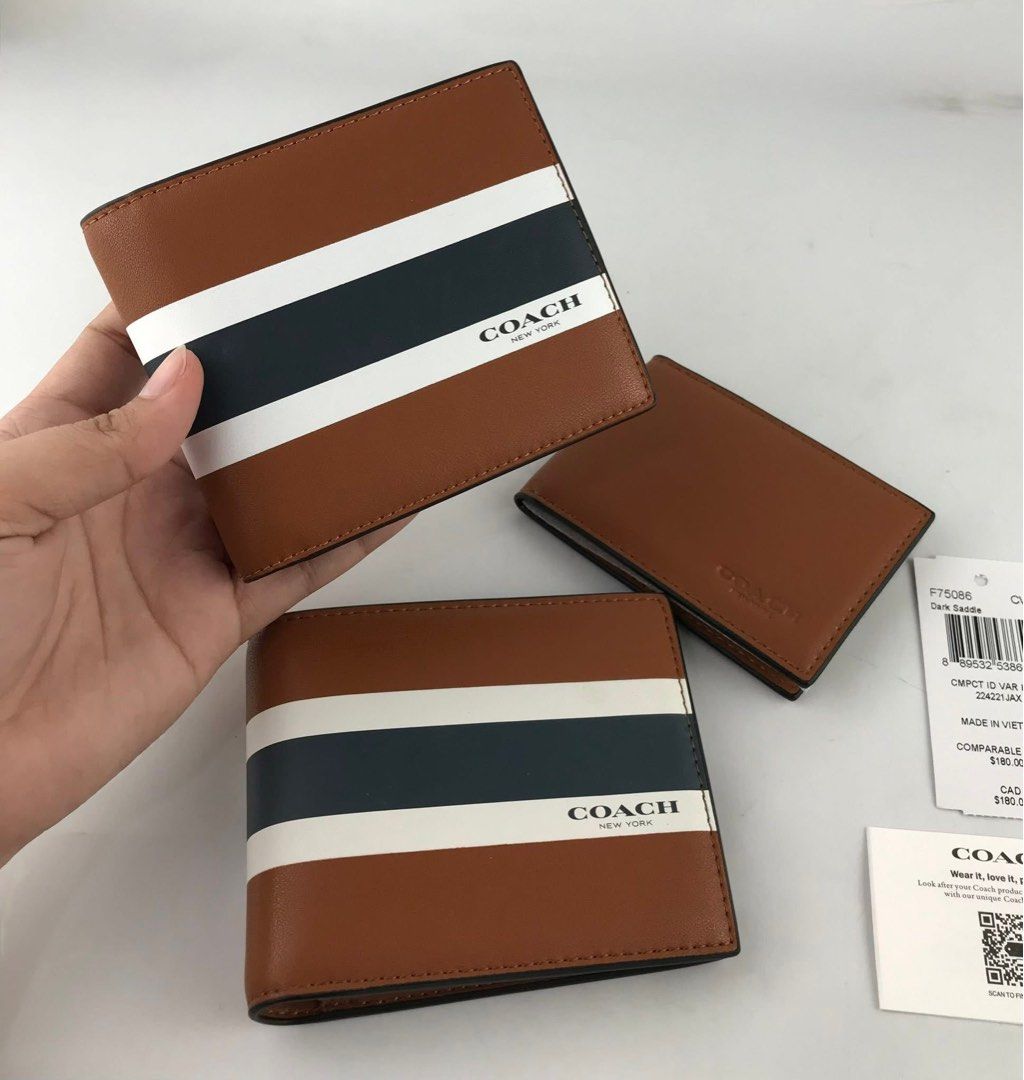 Coach Bifold Wallet with Stripes (Category: Wallets & Card Holders) located in Caloocan City. Submitted by brandeditemsph (Listing ID 1451527736, Image 1). Description: - Genuine Coach bifold wallet - Rich brown leather - Signature stripe design on the front - "Coach New York" branding - Multiple interior card slots - Comes with original tags and packaging - Ideal for everyday use.