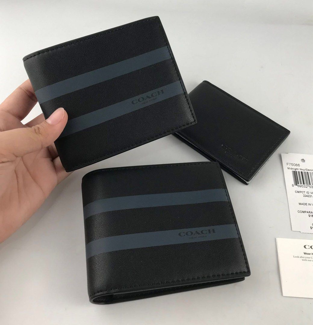 Coach Bifold Wallet with Stripes (Category: Wallets & Card Holders) located in Caloocan City. Submitted by brandeditemsph (Listing ID 1451527796, Image 1). Description: - Brand: Coach - Type: Bifold Wallet - Color: Black - Design: Dark blue stripes on front - Features: Multiple card slots - Condition: Brand new with original tags - Ideal for: Everyday use.
