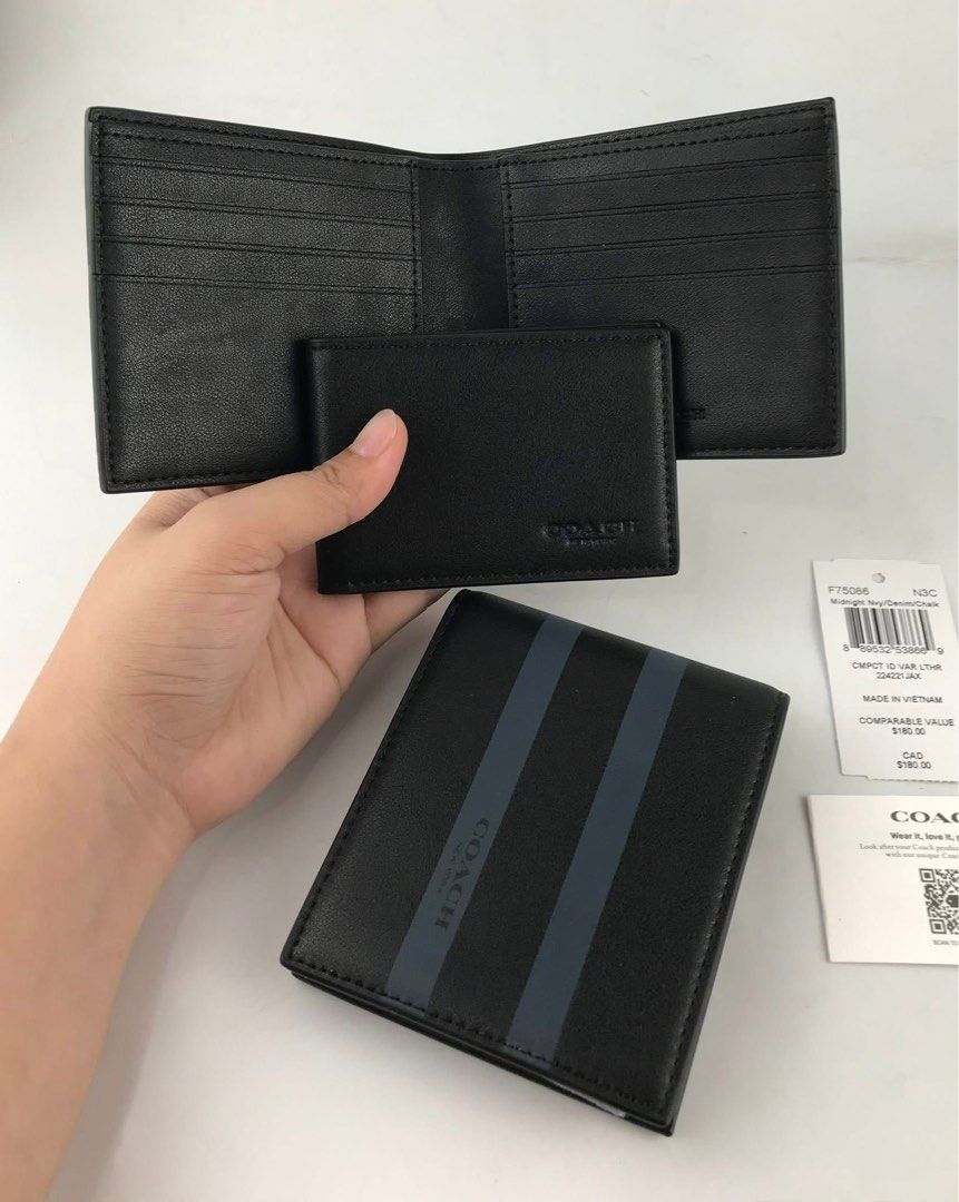 Coach Bifold Wallet with Stripes (Category: Wallets & Card Holders) located in Caloocan City. Submitted by brandeditemsph (Listing ID 1451527796, Image 2). Description: - Brand: Coach - Type: Bifold Wallet - Color: Black - Design: Dark blue stripes on front - Features: Multiple card slots - Condition: Brand new with original tags - Ideal for: Everyday use.