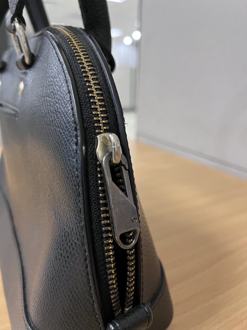 Coach Black Leather Dome Satchel Handbag (Category: Luxury Bags & Wallets) located in Pasig City. Submitted by zen_it_all (Listing ID 1451696733, Image 3). Description: - black leather Coach satchel - Classic dome shape with comfortable top handles - Replace zipper puller closure -zipper not so smooth when opening the bag -no hangtag, missing strap (you can use a generic one)) - Exterior back slip pocket for quick access - Protective metal feet o