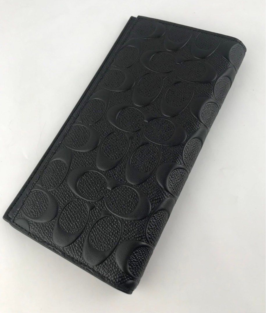 Coach Black Signature Long Wallet (Category: Wallets & Card holders) located in Caloocan City. Submitted by brandeditemsph (Listing ID 1451527642, Image 2). Description: - Authentic Black Coach Long Wallet - Signature embossed C pattern all over - Numerous card slots for ample storage - Zippered compartment for coins or small items - Clean and well-maintained interior - Ideal for organizing your daily essentials.