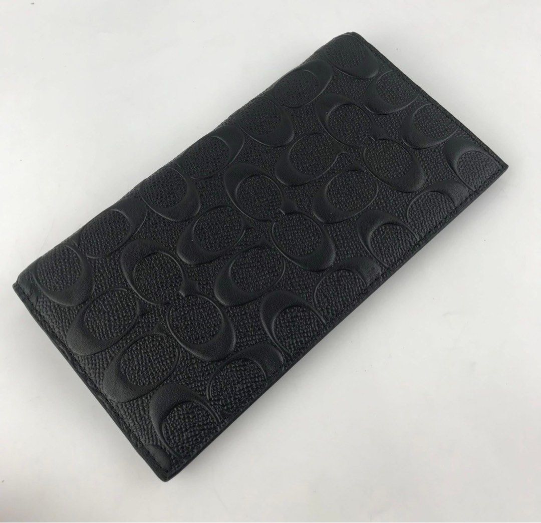 Coach Black Signature Long Wallet (Category: Wallets & Card holders) located in Caloocan City. Submitted by brandeditemsph (Listing ID 1451527642, Image 3). Description: - Authentic Black Coach Long Wallet - Signature embossed C pattern all over - Numerous card slots for ample storage - Zippered compartment for coins or small items - Clean and well-maintained interior - Ideal for organizing your daily essentials.