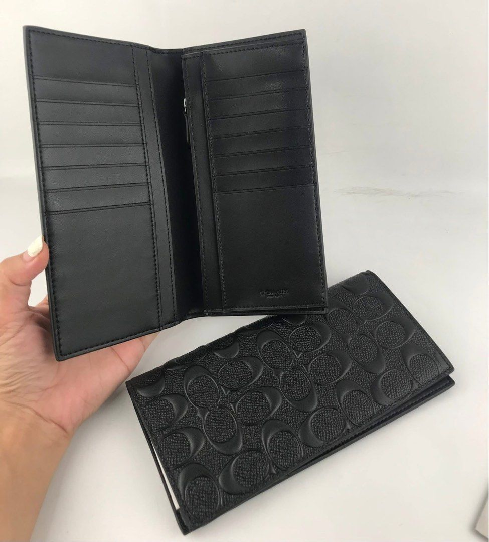 Coach Black Signature Long Wallet (Category: Wallets & Card holders) located in Caloocan City. Submitted by brandeditemsph (Listing ID 1451527642, Image 1). Description: - Authentic Black Coach Long Wallet - Signature embossed C pattern all over - Numerous card slots for ample storage - Zippered compartment for coins or small items - Clean and well-maintained interior - Ideal for organizing your daily essentials.