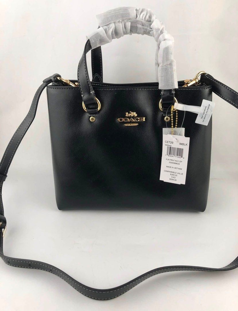 Coach CET29 Flt Print Acc Zip Tote Bag Black (Category: Tote Bags) located in Caloocan City. Submitted by brandeditemsph (Listing ID 1451528310, Image 1). Description: - Authentic Coach tote bag in classic black. - Versatile carrying options: top handles and a detachable crossbody strap. - Interior zip pocket for secure storage. - Comes with original tags. - Made in Vietnam. - Original comparable value: $295.00..