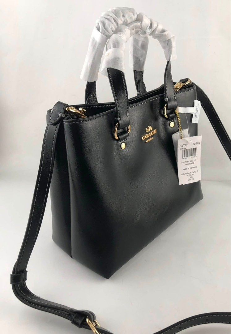 Coach CET29 Flt Print Acc Zip Tote Bag Black (Category: Tote Bags) located in Caloocan City. Submitted by brandeditemsph (Listing ID 1451528310, Image 2). Description: - Authentic Coach tote bag in classic black. - Versatile carrying options: top handles and a detachable crossbody strap. - Interior zip pocket for secure storage. - Comes with original tags. - Made in Vietnam. - Original comparable value: $295.00..