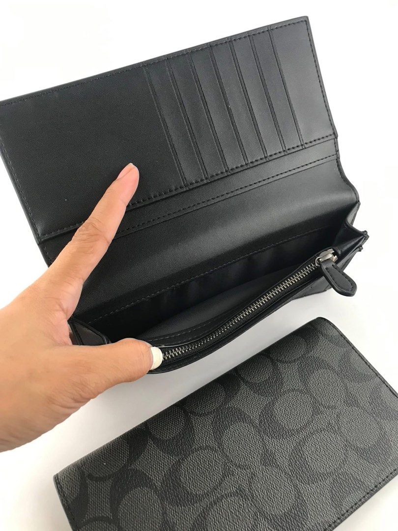 Coach Signature Long Wallet (Category: Wallets & Card holders) located in Caloocan City. Submitted by brandeditemsph (Listing ID 1451527597, Image 2). Description: - Coach long wallet - Signature print in black and grey - Ample card slots for organization - Zippered compartment for coins or small items - Clean interior - Ideal for keeping your essentials tidy.