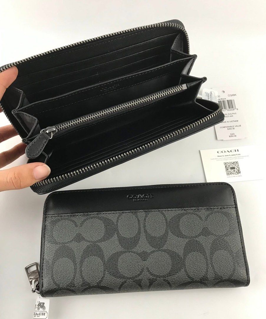 Coach Signature Zip Around Wallet (Category: Wallets & Card holders) located in Caloocan City. Submitted by brandeditemsph (Listing ID 1451527256, Image 2). Description: - Authentic Coach Zip Around Wallet - Color: Black and Grey Signature Print - Ample card slots and compartments for organization - Comes with original tags - Includes authenticity card - Perfect for keeping your essentials tidy.