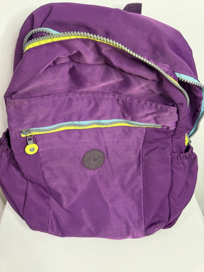 Cosè Style Purple Backpack (Category: Backpacks) located in Pasig City. Submitted by tinylittlestore (Listing ID 1451697772, Image 3). Description: In Good Condition Used with care All zipper working No damage or flaws .