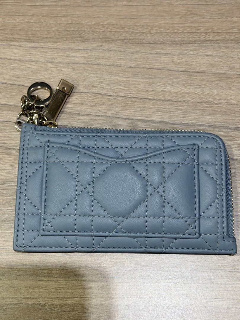 CHRISTIAN DIOR (Auth) Card Holder with Charms (Category: Luxury Bags & Wallets) located in Pasig City. Submitted by theclosetcasemanila (Listing ID 1451622094, Image 1). Description: - Guaranteed Authentic Dior card holder - Elegant quilted pattern on the front - Convenient card slots on the back - Secure zipper closure - Adorned with signature Dior charms on the zipper (detachable) No box or dustbag. Item is unused. .