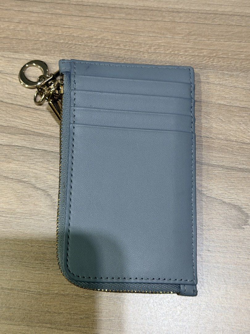 CHRISTIAN DIOR (Auth) Card Holder with Charms (Category: Luxury Bags & Wallets) located in Pasig City. Submitted by theclosetcasemanila (Listing ID 1451622094, Image 2). Description: - Guaranteed Authentic Dior card holder - Elegant quilted pattern on the front - Convenient card slots on the back - Secure zipper closure - Adorned with signature Dior charms on the zipper (detachable) No box or dustbag. Item is unused. .