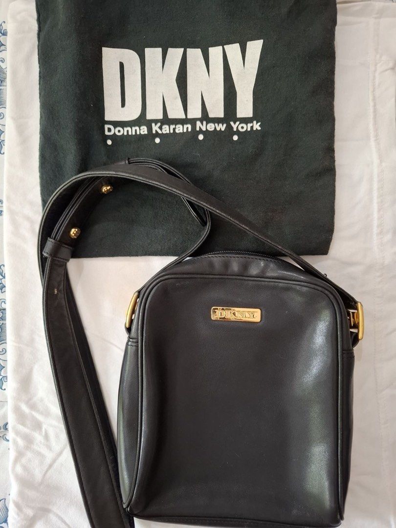 DKNY Black Leather Crossbody Bag (Category: Cross-body Bags) located in Muntinlupa City. Submitted by everythingmustgo_8475da (Listing ID 1449803255, Image 2). Description: - Classic black DKNY crossbody bag - Made of genuine leather - Features elegant gold hardware - Adjustable strap for customized comfort - Versatile for everyday use or evening outings - Simple, chic, and functional design - Perfectly fits your essentials.