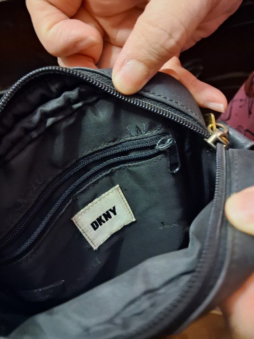DKNY Black Leather Crossbody Bag (Category: Cross-body Bags) located in Muntinlupa City. Submitted by everythingmustgo_8475da (Listing ID 1449803255, Image 3). Description: - Classic black DKNY crossbody bag - Made of genuine leather - Features elegant gold hardware - Adjustable strap for customized comfort - Versatile for everyday use or evening outings - Simple, chic, and functional design - Perfectly fits your essentials.