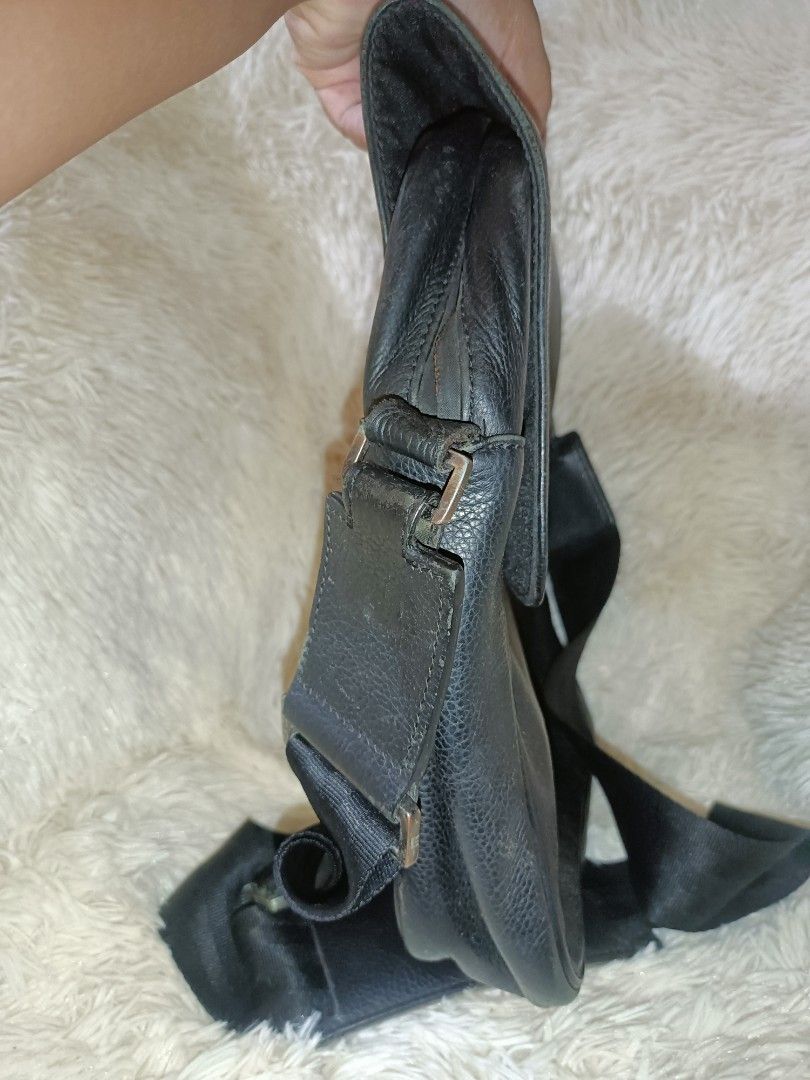 Dunhill Black Leather Messenger Bag with Adjustable Strap (Category: Luxury Bags & Wallets) located in Bolinao. Submitted by shayne_0215 (Listing ID 1451629750, Image 3). Description: - Last Price Posted with Free Shipping - Genuine black leather messenger bag - Textured leather finish - Adjustable strap with metal buckle - Spacious interior for essentials - Ideal for everyday use or travel - With obvious signs of wear Deal Now, Pay Now MOP: GCAS