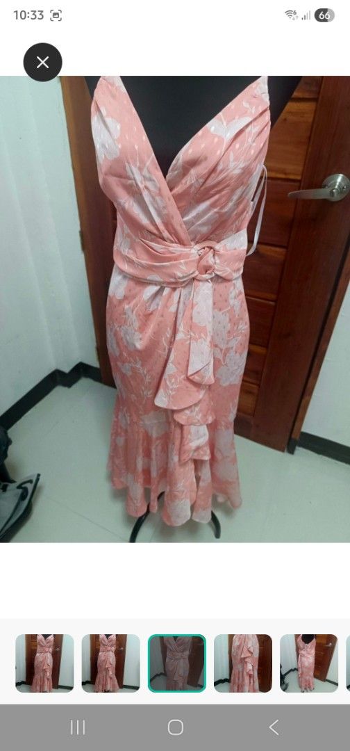 Ever New dress (Category: Dresses) located in Paranaque City. Submitted by declutterproject (Listing ID 1451534574, Image 3). Description: - Pretty pink midi dress with a lovely floral print. - Flattering V-neckline and wrap-style bodice. - Elegant waterfall hem with delicate ruffles. - Adjustable tie belt at the waist for a perfect fit. - Ideal for special occasions, parties, or a stylish dinner date. - Comfortable and effortlessly chic..