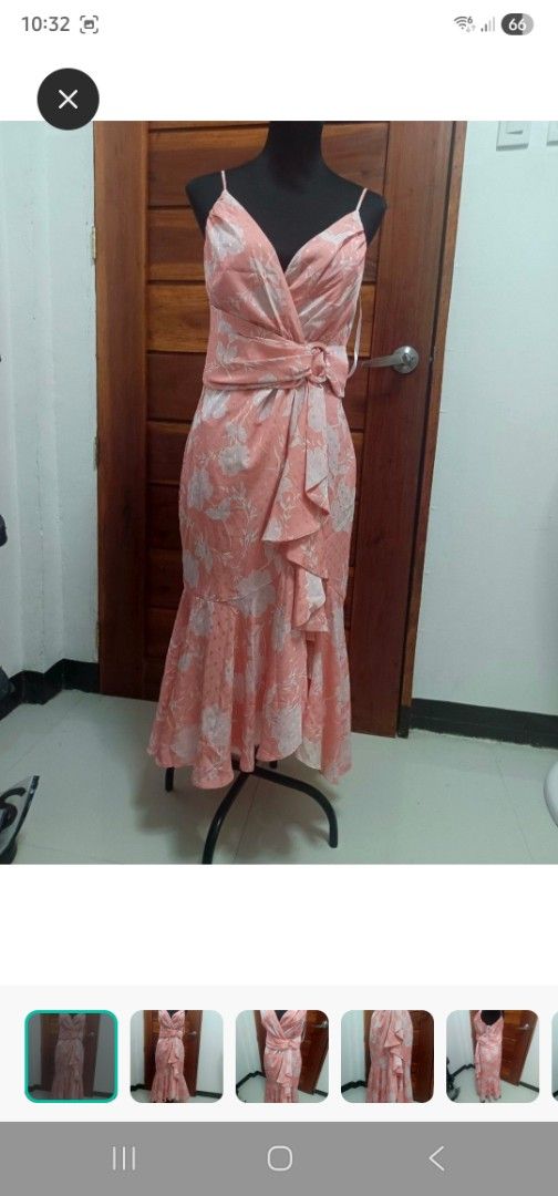 Ever New dress (Category: Dresses) located in Paranaque City. Submitted by declutterproject (Listing ID 1451534574, Image 2). Description: - Pretty pink midi dress with a lovely floral print. - Flattering V-neckline and wrap-style bodice. - Elegant waterfall hem with delicate ruffles. - Adjustable tie belt at the waist for a perfect fit. - Ideal for special occasions, parties, or a stylish dinner date. - Comfortable and effortlessly chic..