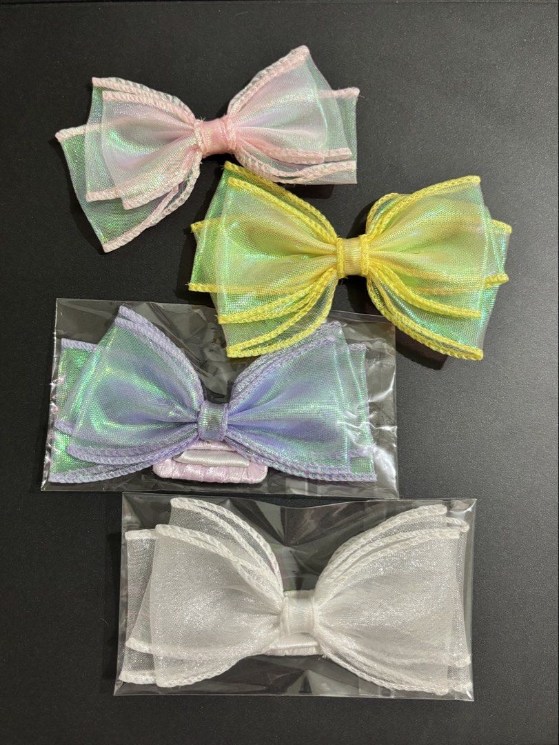Fancy Iridescent Bow Hairclip for Dogs (Category: Homes & Other Pet Accessories) located in Manila. Submitted by chonkkiecartz (Listing ID 1451558043, Image 1). Description: Handmade & matibay— suitable for both short-haired and long-haired dogs 💜 Available in 🤍💛🩷💜🧡🩵 Brand: JB&Pea ₱80 each; Multiple quantities available 🎀 .