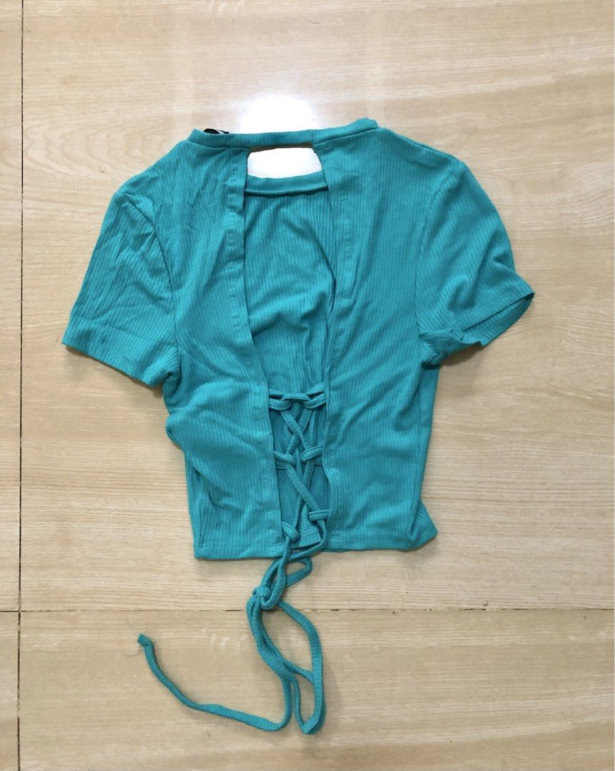 FB Sister ribbed open back with adjustable tie (Category: Others Tops) located in Urdaneta. Submitted by byells (Listing ID 1451558303, Image 2). Description: S on tag will fit Small - medium Teal color Stretchable Like new no issue.