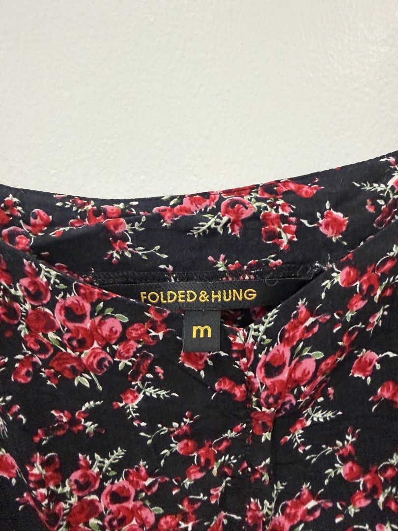Folded & Hung Floral Cami Top with Lace Trim (Category: Sleeveless) located in Taguig. Submitted by chrisern35 (Listing ID 1451584591, Image 3). Description: - Black cami top - Features a red floral print - Thin spaghetti straps - Delicate lace trim along the hem - Super cute and flowy design - Perfect for casual wear or dressing up Chest - 43cm Length - 46cm.