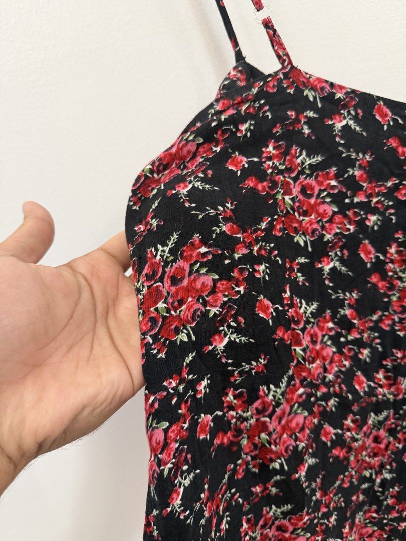 Folded & Hung Floral Cami Top with Lace Trim (Category: Sleeveless) located in Taguig. Submitted by chrisern35 (Listing ID 1451584591, Image 2). Description: - Black cami top - Features a red floral print - Thin spaghetti straps - Delicate lace trim along the hem - Super cute and flowy design - Perfect for casual wear or dressing up Chest - 43cm Length - 46cm.