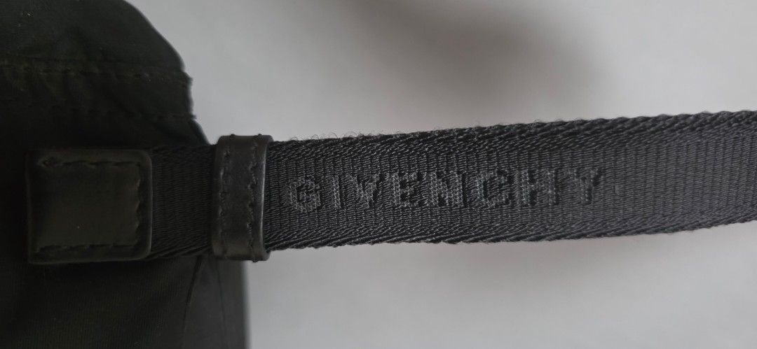 Givenchy Black Nylon Crossbody Bag (Category: Luxury Bags & Wallets) located in Marikina City. Submitted by kgcdl (Listing ID 1451618495, Image 3). Description: - Authentic Givenchy black nylon crossbody bag - Features iconic Givenchy logo on strap and metal logo on front - Secure zipper closure - Expertly crafted in Italy - Ideal for everyday wear and convenience -PLS MSG ONLY.FOR SURE BUYERS! DECENT OFFERS ONLY.