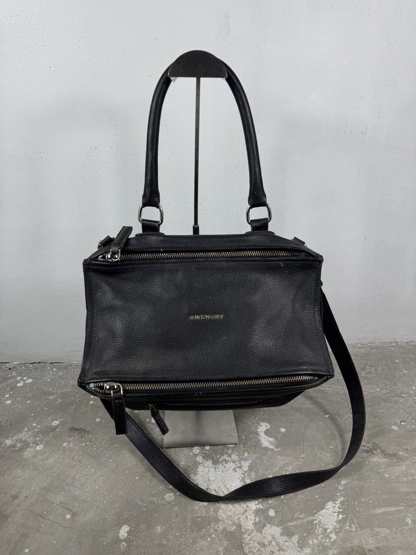 Givenchy two way bag (Category: Luxury Bags & Wallets) located in Quezon City. Submitted by streetgallerygarments (Listing ID 1451676796, Image 1). Description: Givenchy pandora Condition:9/10 Issue:need cleaning and minimal sign of usage Shipping Jnt/lalamove Authentic not guarented Please check before purchasing thankyou.