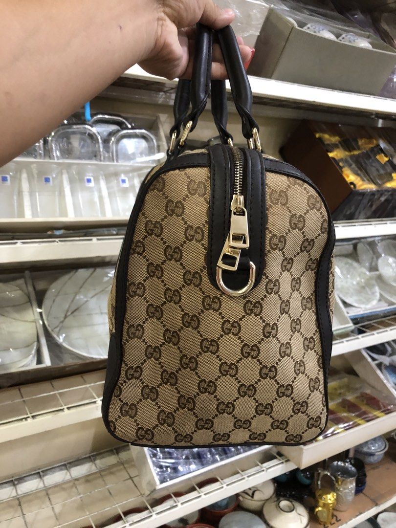 GUCCI BAG (Category: Tote Bags) located in Manila. Submitted by beyondessence (Listing ID 1451622865, Image 2). Description: Gucci Vintage Web Bee Boston Bag crafted in signature GG canvas with a green and red web stripe and a gold-tone bee motif..