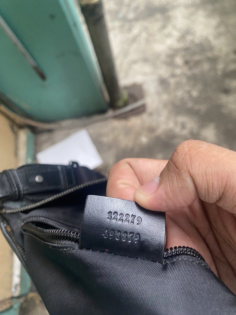 Gucci Monogram Crossbody Bag (Category: Luxury Bags & Wallets) located in Manila. Submitted by reymarkliwanag.244 (Listing ID 1451629252, Image 3). Description: - Authentic Gucci crossbody bag - Classic GG monogram pattern in black - Black leather trim and adjustable strap - Secure zipper closure - Interior tag with serial numbers: 322279 493379 - Made in Italy - Ideal for everyday use.
