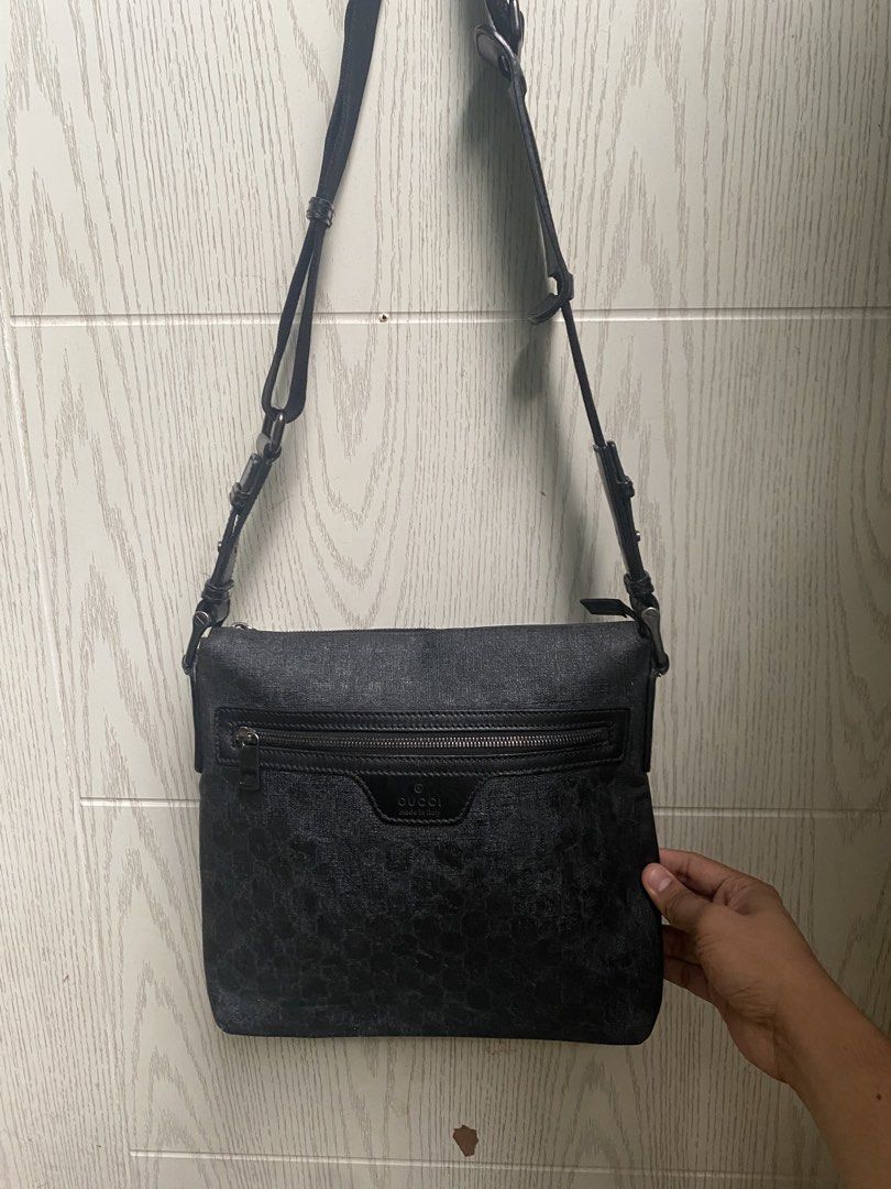 Gucci Monogram Crossbody Bag (Category: Luxury Bags & Wallets) located in Manila. Submitted by reymarkliwanag.244 (Listing ID 1451629252, Image 1). Description: - Authentic Gucci crossbody bag - Classic GG monogram pattern in black - Black leather trim and adjustable strap - Secure zipper closure - Interior tag with serial numbers: 322279 493379 - Made in Italy - Ideal for everyday use.