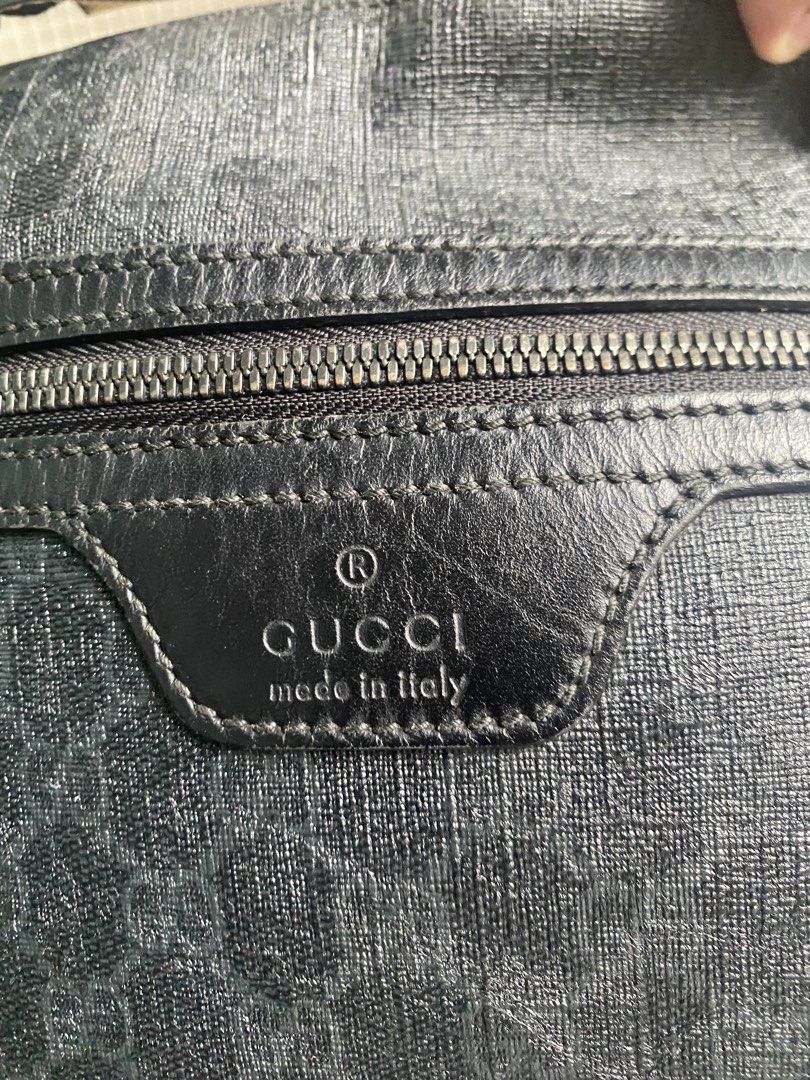 Gucci Monogram Crossbody Bag (Category: Luxury Bags & Wallets) located in Manila. Submitted by reymarkliwanag.244 (Listing ID 1451629252, Image 2). Description: - Authentic Gucci crossbody bag - Classic GG monogram pattern in black - Black leather trim and adjustable strap - Secure zipper closure - Interior tag with serial numbers: 322279 493379 - Made in Italy - Ideal for everyday use.