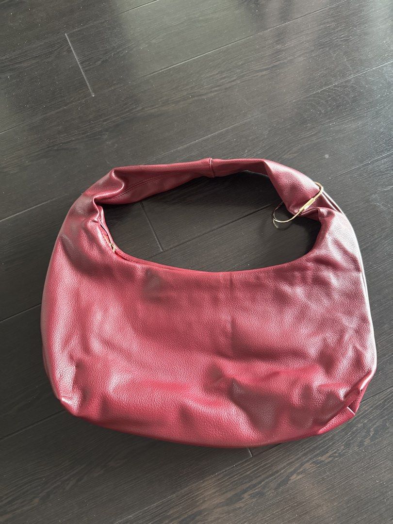 GVN Medium Hobo Bag in Burgundy (Category: Shoulder Bags) located in Marikina City. Submitted by akda7 (Listing ID 1451596519, Image 3). Description: - Burgundy shoulder bag - Faux leather material - Zippered interior pocket - Gold hardware details - Simple and chic design - Ideal for everyday use.