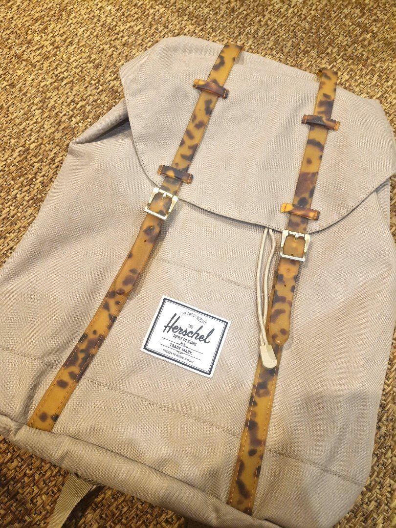 Herschel Supply Co. Backpack Tan Tortoise Buckle Straps (Category: Backpacks) located in Quezon City. Submitted by gelaborbs (Listing ID 1451637875, Image 2). Description: - Herschel Supply Co. backpack in a stylish tan color. - Unique tortoise shell buckle straps for secure closure. - Classic red and white striped interior lining. - Adjustable shoulder straps for personalized comfort. - Spacious interior, ideal for everyday essentials or travel 