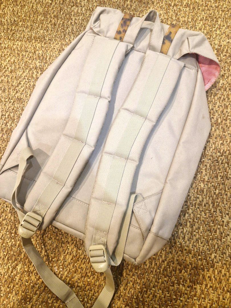 Herschel Supply Co. Backpack Tan Tortoise Buckle Straps (Category: Backpacks) located in Quezon City. Submitted by gelaborbs (Listing ID 1451637875, Image 3). Description: - Herschel Supply Co. backpack in a stylish tan color. - Unique tortoise shell buckle straps for secure closure. - Classic red and white striped interior lining. - Adjustable shoulder straps for personalized comfort. - Spacious interior, ideal for everyday essentials or travel 