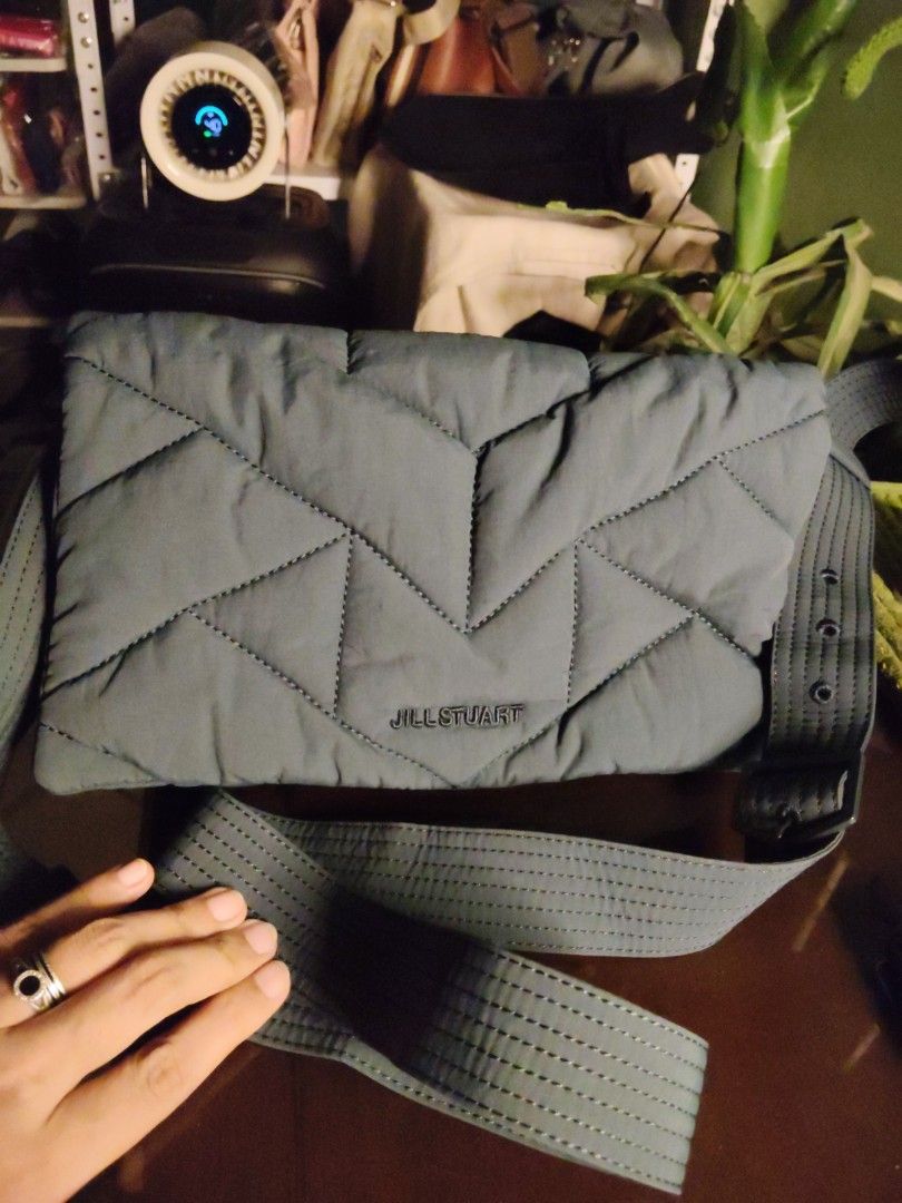Jill Stuart Puffer Crossbody bag (Category: Cross-body Bags) located in Quirino. Submitted by megay12 (Listing ID 1451674567, Image 1). Description: - Jill Stuart puffer bag in a stylish blue green color. - Features a chic quilted design on the front. - Comes with an adjustable strap for comfortable wear. - Interior includes a secure zip pocket and an additional compartment. - Ideal for everyday use. - Bag is clean inside and out..