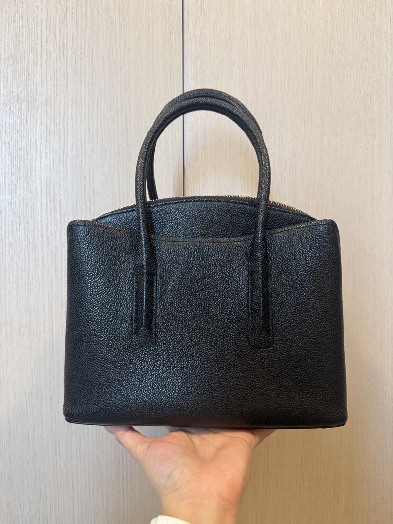 Kate Spade Margaux Medium Top Handle Bag (Category: Luxury Bags & Wallets) located in Caloocan City. Submitted by lovelunaa (Listing ID 1451611572, Image 2). Description: - black leather Kate Spade handbag - Classic top handle design - Secure zip closure on top - Adorable small heart charm detail - Structured base with protective metal feet - Ideal for everyday use - Ample interior space - with long strap - with minor marks, see photo.
