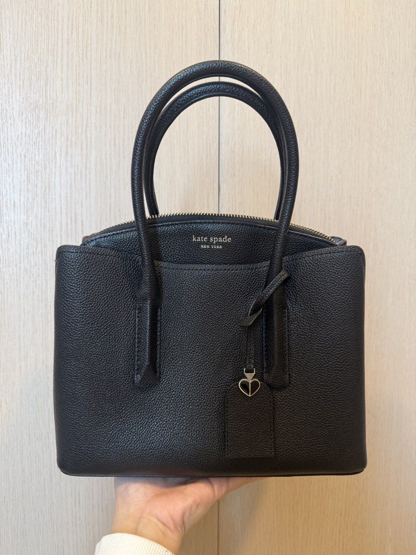 Kate Spade Margaux Medium Top Handle Bag (Category: Luxury Bags & Wallets) located in Caloocan City. Submitted by lovelunaa (Listing ID 1451611572, Image 1). Description: - black leather Kate Spade handbag - Classic top handle design - Secure zip closure on top - Adorable small heart charm detail - Structured base with protective metal feet - Ideal for everyday use - Ample interior space - with long strap - with minor marks, see photo.