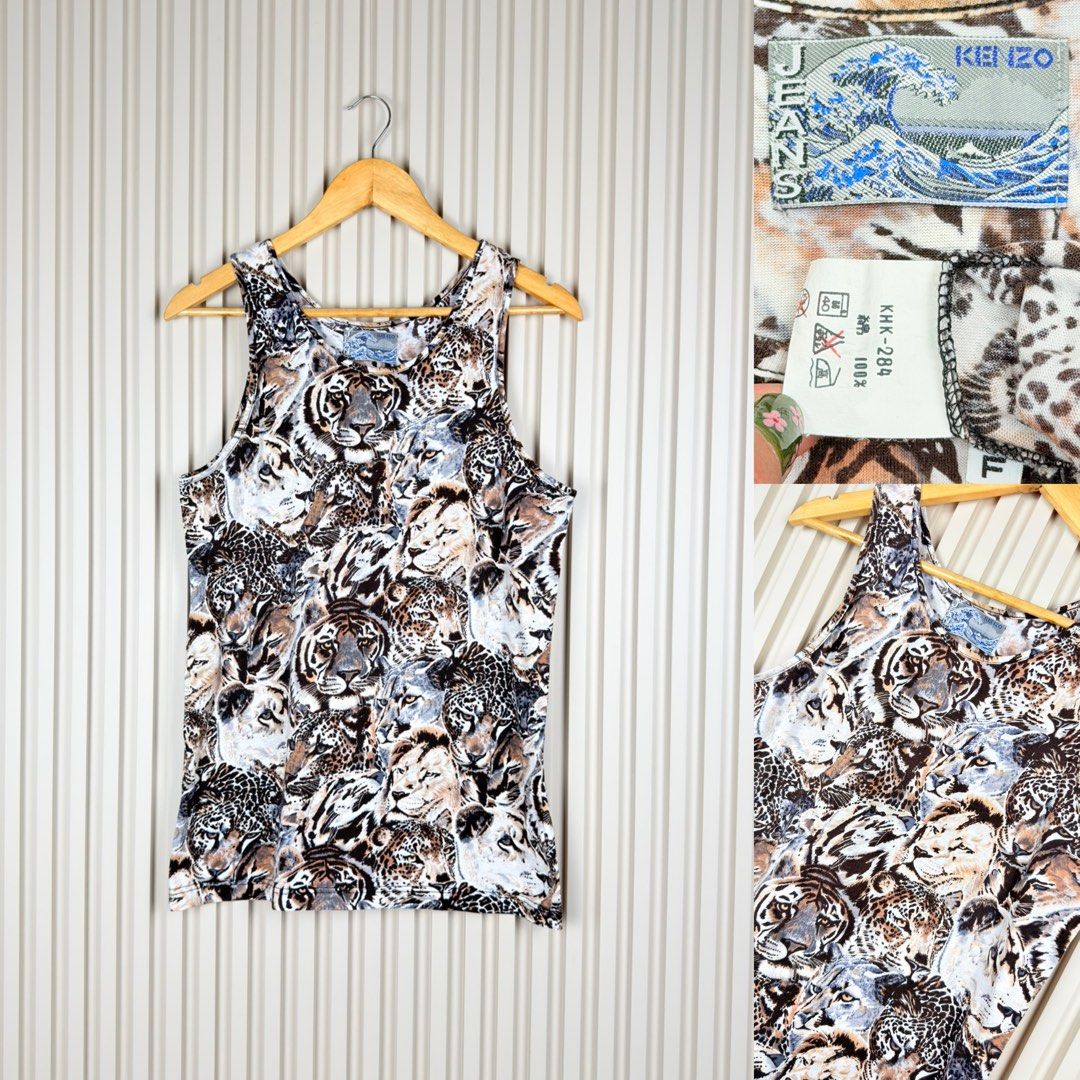 Kenzo Jeans Tiger Print Tank Top (Category: Sleeveless) located in Pasig City. Submitted by trendapparelph (Listing ID 1451610654, Image 1). Description: - Kenzo Jeans tank top - Bold all-over tiger and leopard face print - Sleeveless design - 100% cotton - Perfect for a statement look.