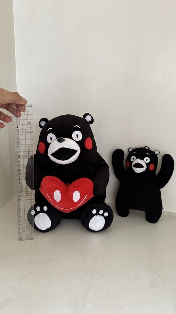 Kumamon Plush Toys - Large and Small (Category: Plushies & Soft Toys) located in Quezon City. Submitted by art_workk (Listing ID 1451685797, Image 1). Description: - negotiable naman - Set of 2 Kumamon plush toys!! for only 200 pesos - From japan - Rfs: not into stuffed toys anymore! - fast decluttering lang - Large plush holding a red heart - Smaller plush standing with arms raised - Classic Kumamon design: black with red cheeks, white eyes/mout