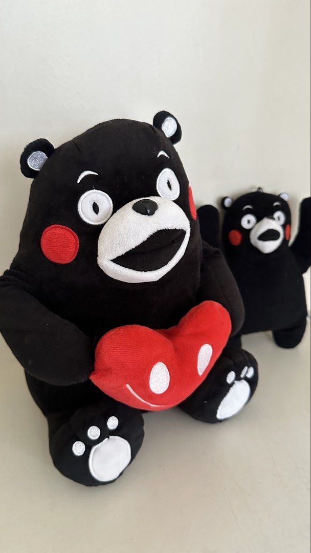 Kumamon Plush Toys - Large and Small (Category: Plushies & Soft Toys) located in Quezon City. Submitted by art_workk (Listing ID 1451685797, Image 2). Description: - negotiable naman - Set of 2 Kumamon plush toys!! for only 200 pesos - From japan - Rfs: not into stuffed toys anymore! - fast decluttering lang - Large plush holding a red heart - Smaller plush standing with arms raised - Classic Kumamon design: black with red cheeks, white eyes/mout