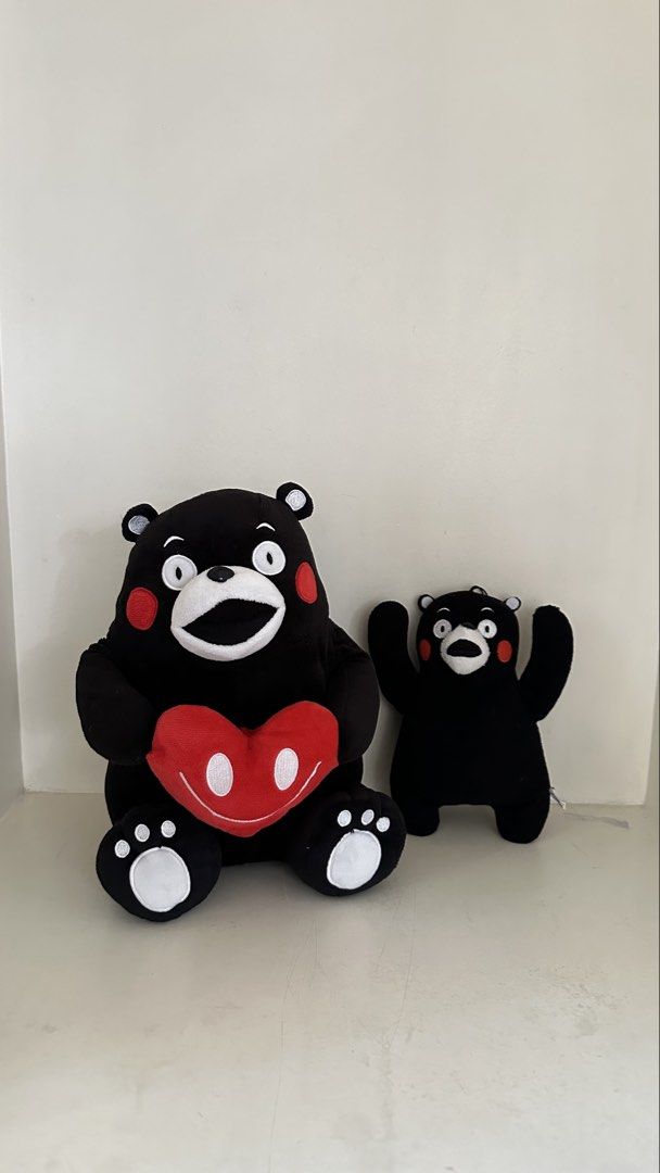 Kumamon Plush Toys - Large and Small (Category: Plushies & Soft Toys) located in Quezon City. Submitted by art_workk (Listing ID 1451685797, Image 3). Description: - negotiable naman - Set of 2 Kumamon plush toys!! for only 200 pesos - From japan - Rfs: not into stuffed toys anymore! - fast decluttering lang - Large plush holding a red heart - Smaller plush standing with arms raised - Classic Kumamon design: black with red cheeks, white eyes/mout