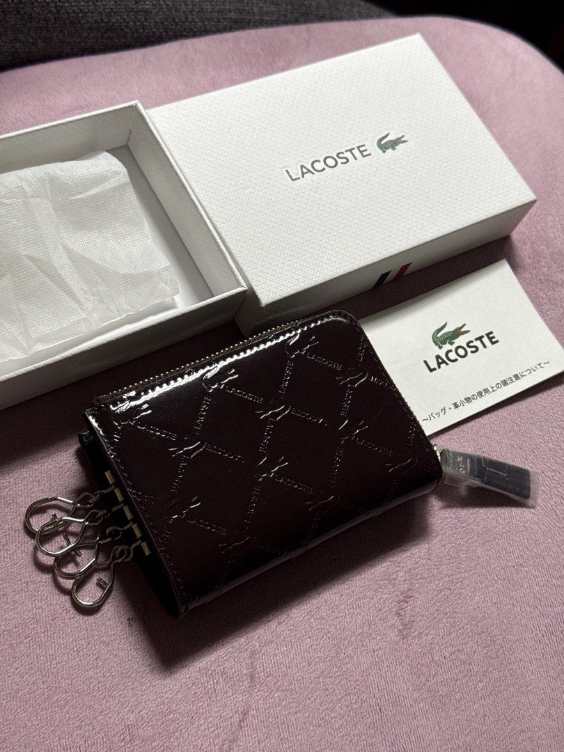 Lacoste Monogram Key Pouch with Box (Category: Luxury Bags & Wallets) located in Pasay City. Submitted by itskshop (Listing ID 1451662141, Image 2). Description: - Authentic Lacoste key pouch - Signature all-over monogram pattern - Dark brown, glossy finish - Secure zipper closure - Interior key hooks and small compartments - Comes with original Lacoste box - Includes authenticity card - Perfect for organizing keys and cards Sobrang ganda please 