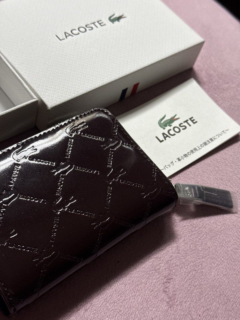 Lacoste Monogram Key Pouch with Box (Category: Luxury Bags & Wallets) located in Pasay City. Submitted by itskshop (Listing ID 1451662141, Image 1). Description: - Authentic Lacoste key pouch - Signature all-over monogram pattern - Dark brown, glossy finish - Secure zipper closure - Interior key hooks and small compartments - Comes with original Lacoste box - Includes authenticity card - Perfect for organizing keys and cards Sobrang ganda please 