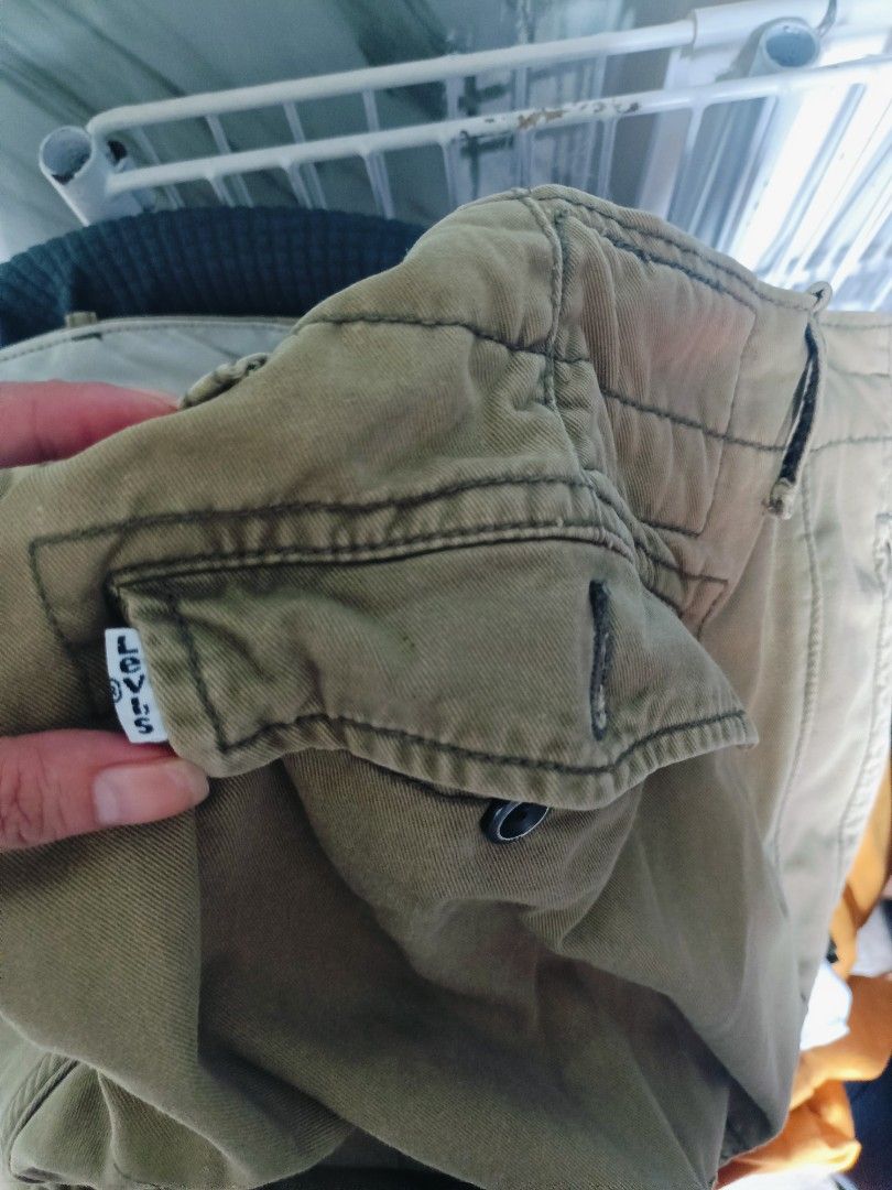 Levi's Strauss & Co. Cargo Pants Khaki (Category: Jeans) located in San Pablo. Submitted by amei56625 (Listing ID 1451592534, Image 2). Description: - Brand: Levi's - Style: Khaki Cargo Pants - Features: Classic workwear design, durable material, multiple storage pockets - Closure: Button and zip fly - Ideal for: Everyday wear.