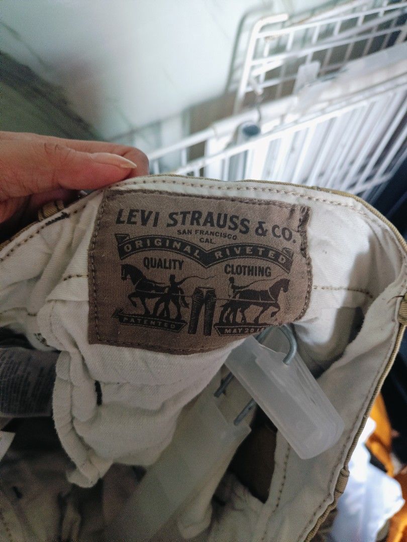 Levi's Strauss & Co. Cargo Pants Khaki (Category: Jeans) located in San Pablo. Submitted by amei56625 (Listing ID 1451592534, Image 3). Description: - Brand: Levi's - Style: Khaki Cargo Pants - Features: Classic workwear design, durable material, multiple storage pockets - Closure: Button and zip fly - Ideal for: Everyday wear.