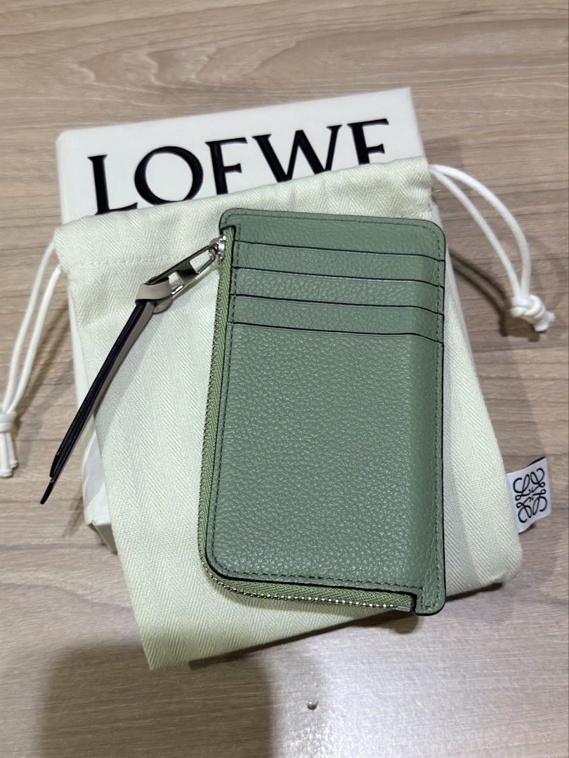 LOEWE (Auth) Cardholder Pouch Mint Green Leather (Category: Luxury Bags & Wallets) located in Pasig City. Submitted by theclosetcasemanila (Listing ID 1451614467, Image 3). Description: - Authentic - Complete box and dustbag - Loewe cardholder w zip pouch - Color: Mint green and tan leather - Closure: Zipper - Features: Multiple card slots on the back - Includes: Dust bag and original box - Benefit: Ideal for keeping your cards organized.