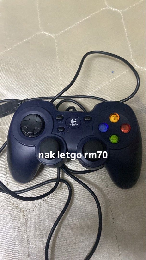 Logitech Game Controller (Category: Controllers) located in Kuala Lumpur. Submitted by ewllll (Listing ID 1451677517, Image 1). Description: - Logitech Game Controller for PC - Wired connection for reliable performance - Features directional pad, analog stick, and face buttons - Perfect for a wide range of PC games - Selling for RM70 - Boleh nego.