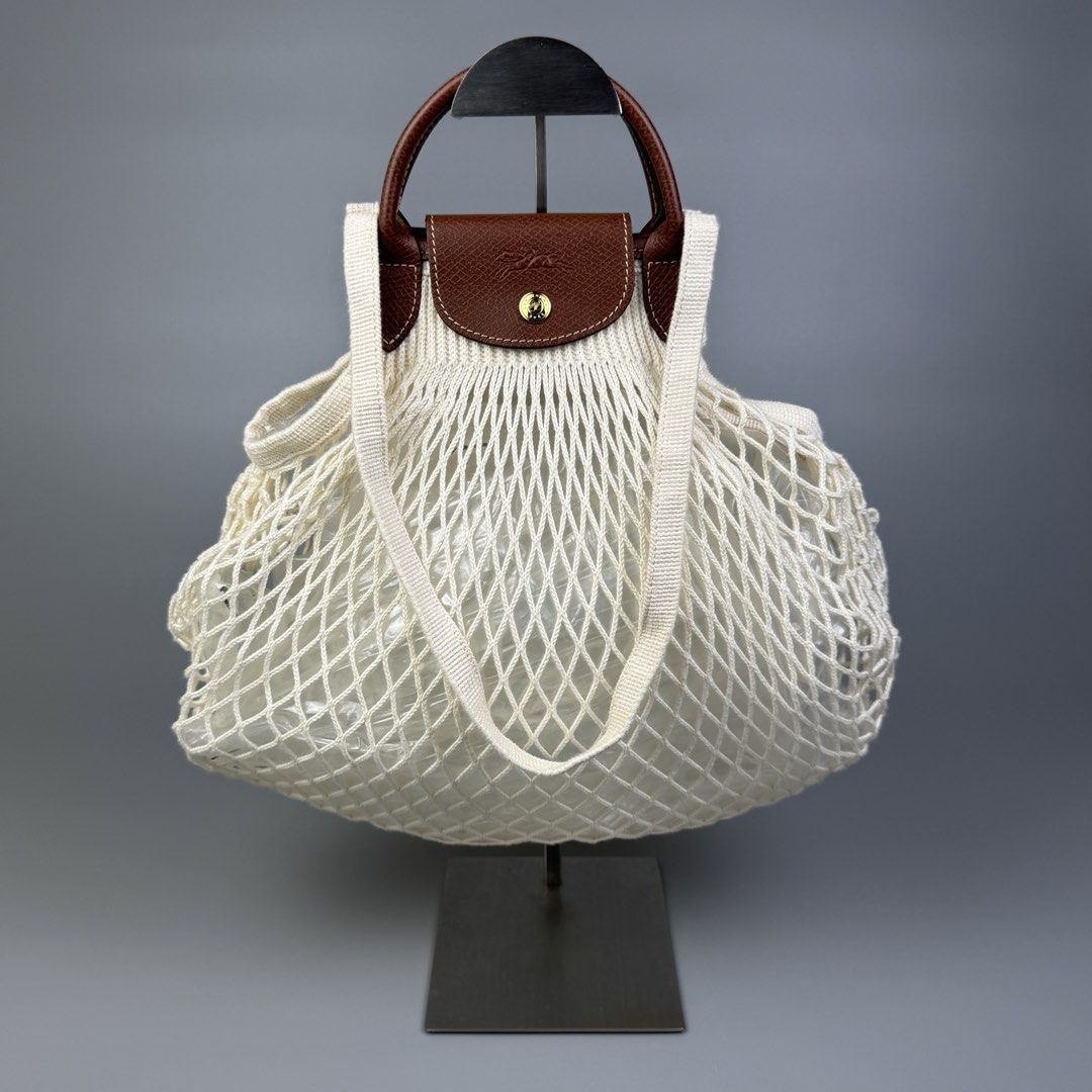 Longchamp - Le Pliage Filet Mesh Medium Shoulder/ Hand Bag (Category: Luxury Bags & Wallets) located in Quezon City. Submitted by japon_rose (Listing ID 1451669022, Image 1). Description: READ DESCRIPTION FIRST BEFORE YOU START A DEAL GUARANTEED AUTHENTIC ❗️ Longchamp - Le Pliage Filet Mesh Medium Shoulder/ Hand Bag Color: Cream White Dimensions: Length: 13 Width: 15 Side: Free size Under: Free size Shoulder Strap: 10 Handle Drop: 3 (MEASURED IT 