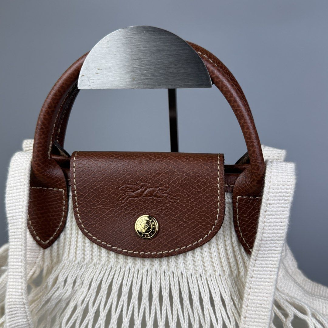Longchamp - Le Pliage Filet Mesh Medium Shoulder/ Hand Bag (Category: Luxury Bags & Wallets) located in Quezon City. Submitted by japon_rose (Listing ID 1451669022, Image 3). Description: READ DESCRIPTION FIRST BEFORE YOU START A DEAL GUARANTEED AUTHENTIC ❗️ Longchamp - Le Pliage Filet Mesh Medium Shoulder/ Hand Bag Color: Cream White Dimensions: Length: 13 Width: 15 Side: Free size Under: Free size Shoulder Strap: 10 Handle Drop: 3 (MEASURED IT 