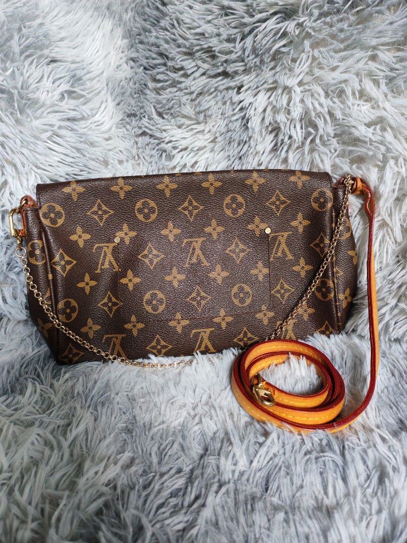 Louis Vuitton Monogram Clutch Bag with Strap (Category: Luxury Bags & Wallets) located in Manila. Submitted by camellesal67218 (Listing ID 1451693527, Image 2). Description: - Authentic but not guaranteed - Detachable strap for crossbody or clutch wear - Leather trim shows some signs of wear - Versatile for everyday or special occasions.
