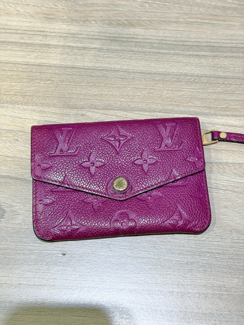 Louis Vuitton Monogram Empreinte Pouch (Category: Luxury Bags & Wallets) located in Pasig City. Submitted by theclosetcasemanila (Listing ID 1451613914, Image 1). Description: - Authentic Louis Vuitton Pouch - Vibrant Pink Color - Iconic Monogram Empreinte Pattern - Zippered Compartment - Snap Closure - Made in France - Perfect for storing cards and cash - Good condition. No dents or scratches. - Missing keychain strap inside (hence the blank hol
